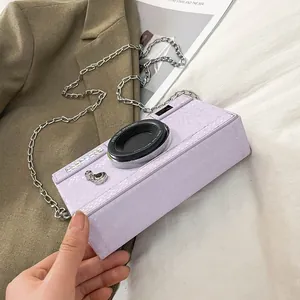 Lavender retro camera-shaped box bag with silver chain and faux-snake texture