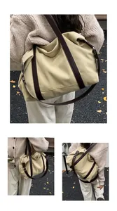 Grande borsa a tracolla in tela kaki da donna con cinturini in pelle marrone