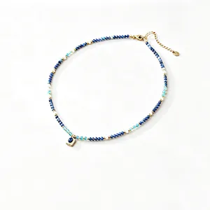 Detailed view of the blue and white beaded choker necklace with square lapis lazuli pendant