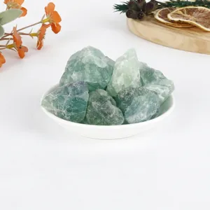 Macro view of natural green fluorite raw crystal stones in a bowl for aromatherapy.