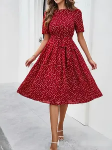 Elegant red polka dot midi dress featuring short sleeves and a stylish waist tie detail.