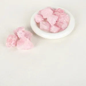 Macro view of raw pink crystal stones for aromatherapy diffuser home decor.
