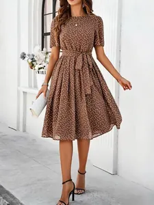 Elegant brown polka dot midi dress with short sleeves and stylish belted waist detail.