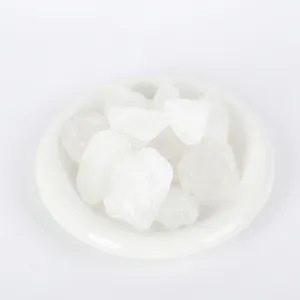 Natural white crystal raw stones for aromatherapy diffuser on elegant white plate