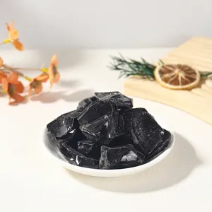 Close-up detail of natural raw black obsidian stones for aromatherapy diffuser use