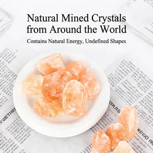 Natural raw Himalayan salt crystals for aromatherapy displayed on a white ceramic plate