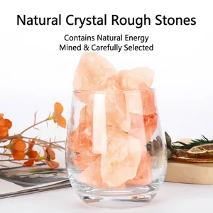 Natural raw pink crystal stones in a clear glass for aromatherapy and home decoration