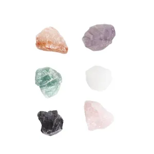 Collection of six different colorful natural crystal raw stones for aromatherapy home decor.