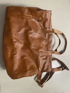 Brown waterproof faux leather convertible travel garment bag with shoulder strap