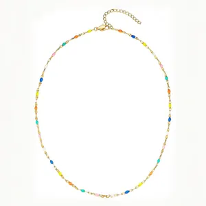 Detailed view of a gold-plated stainless steel necklace with colorful rainbow enamel beads.