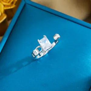 Detailed macro view of a silver adjustable ring featuring a large rectangular crystal stone