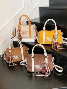 Collection of stylish retro Boston bags in solid colors and trendy leopard prints