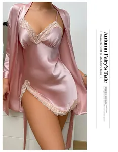 Macro detail of the delicate lace trim on this pink satin nightdress and robe set