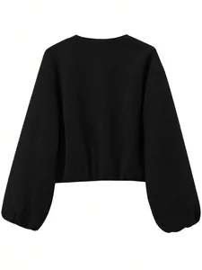 Close-up back view of black soft textured cropped bomber jacket with balloon sleeves.