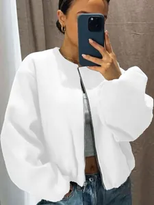 Detailed shot of soft white bomber jacket showing zipper and loose fit style