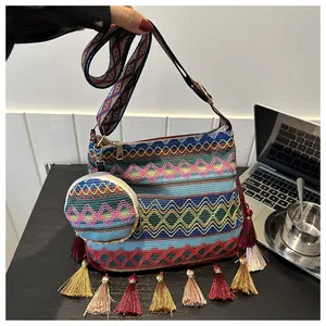 Detailed view of bohemian woven shoulder bag with colorful tassels and matching coin pouch