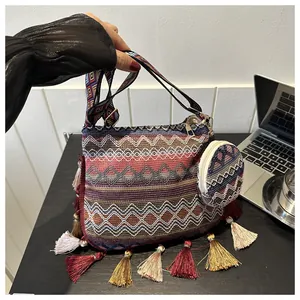 Close-up of a vibrant ethnic style woven shoulder bag with colorful tassels