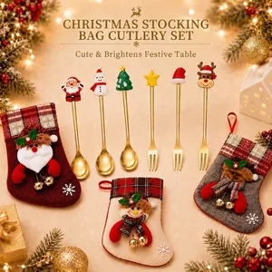 Detail view of gold-plated Christmas cutlery set arranged with mini gift stockings