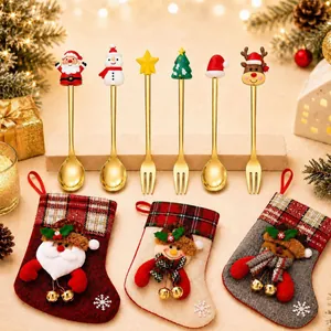 Festive Christmas spoon and fork set with character toppers and decorative stockings.