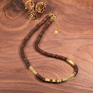 Macro view of retro necklace made with natural coconut shell and gold copper alloy