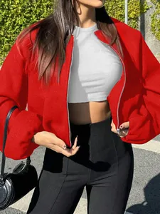 Detail showing the vibrant red fabric and silver zipper of this trendy women's bomber jacket.