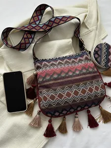 Ethnic style crossbody bag with colorful tassels and geometric patterned wide strap