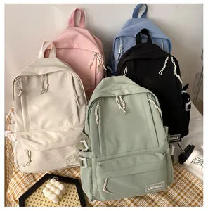Detailed view of large capacity school backpacks in five various solid colors