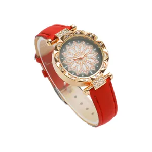 Elegant women's quartz watch featuring a red leather strap and sparkling gold flower bezel