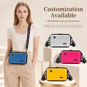 Stylish mini suitcase hard shell crossbody bag for travel in blue silver pink and yellow colors
