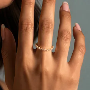 Close-up of a gold-finish sterling silver eternity ring with 2.5mm cubic zirconia stones
