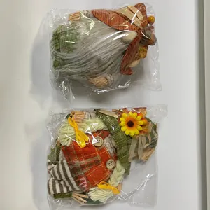 Two Thanksgiving harvest theme faceless gnomes in individual plastic packaging