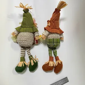 Thanksgiving harvest gnomes with long legs and autumn outfits shown with a ruler