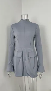 Front detail view of an elegant blue-gray slim-fit dress with flared cuffs and mock neck