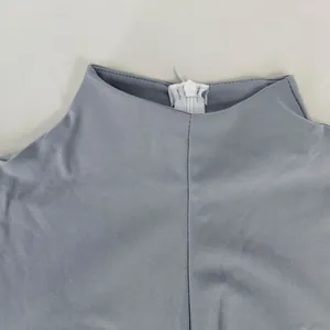Close-up of the back neckline and hidden zipper detail on a grey slim-fit dress