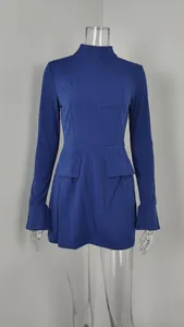 Detail view of a royal blue long sleeve bodycon dress with faux pockets.