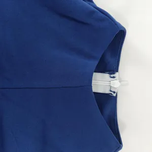 Close-up detail of the invisible zipper on a navy blue elegant slim-fitting dress for women
