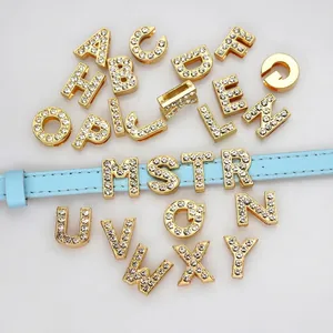 Close-up of 8mm gold rhinestone letter beads for DIY wristbands and jewelry making accessories