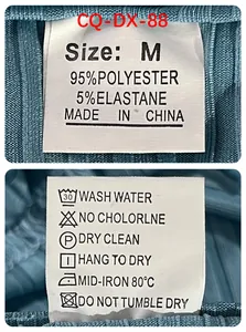Close-up of garment care label for men's polo shirt showing material and washing instructions