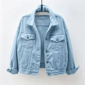 Detail of women's light blue denim jacket featuring lapel collar and chest pockets