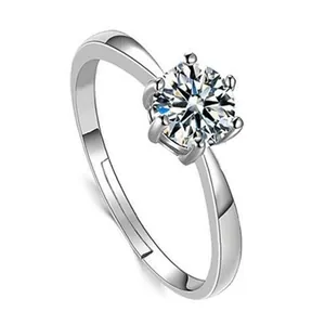 Detailed macro view of a silver adjustable ring featuring a sparkling six-prong zircon stone.