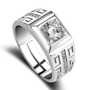 Detailed view of silver men's ring with central cubic zirconia and Greek fret band patterns