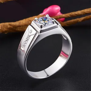 Detailed close-up of a masculine silver-tone ring featuring a large square-set zircon stone