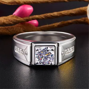 Close-up of a masculine silver ring with a large central sparkling round zircon stone