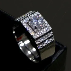 Detailed close-up of a bold silver men's wedding ring with brilliant square zircon setting