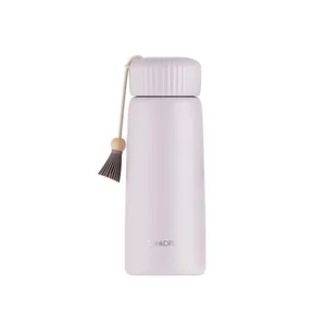 Elegant lavender insulated water bottle featuring a decorative tassel and matte finish