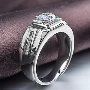 Close-up of a men's silver-toned ring featuring a sparkling round cubic zirconia stone