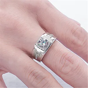Macro detail of men's silver-tone ring featuring a large square-cut zircon stone