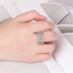 Macro detail of a luxurious men's silver ring with round and baguette zircons