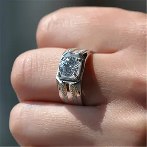 Close-up of a men's silver ring featuring a large square-cut sparkling zircon stone