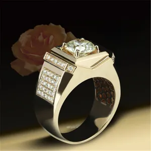 Macro view of a luxurious men's gold-plated ring featuring a large square-set center zircon